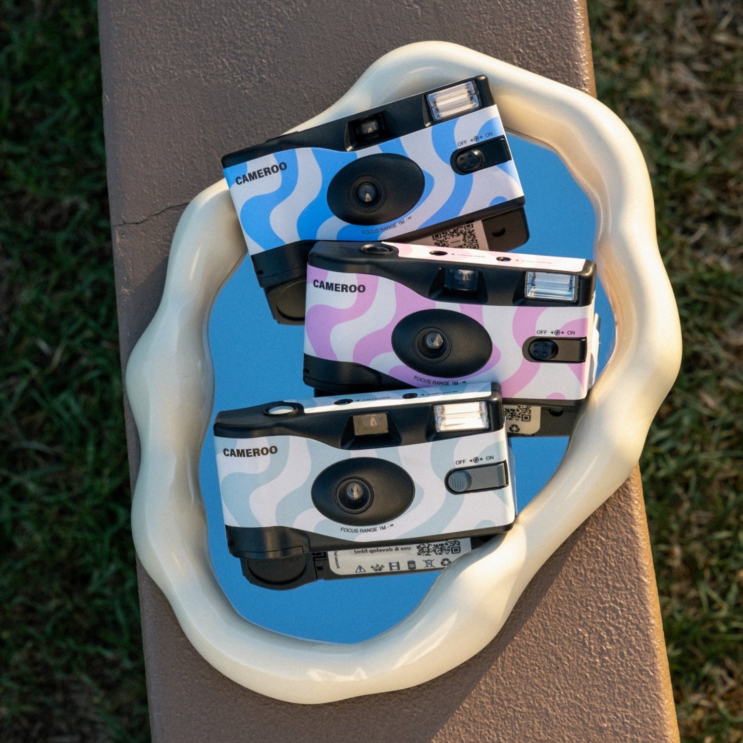Cameroo custom disposable cameras with wavy blue and pink designs