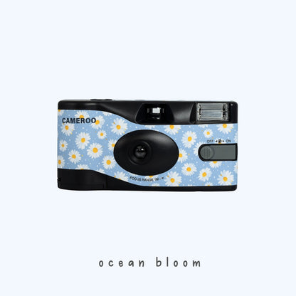 Daisy Bloom disposable camera with white floral pattern and blue accents by Cameroo